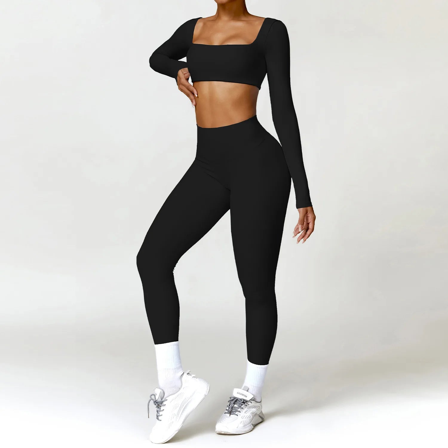 Ensemble de yoga 2 pièces pour femme : survêtement, brassière de sport, haut à manches longues et legging.